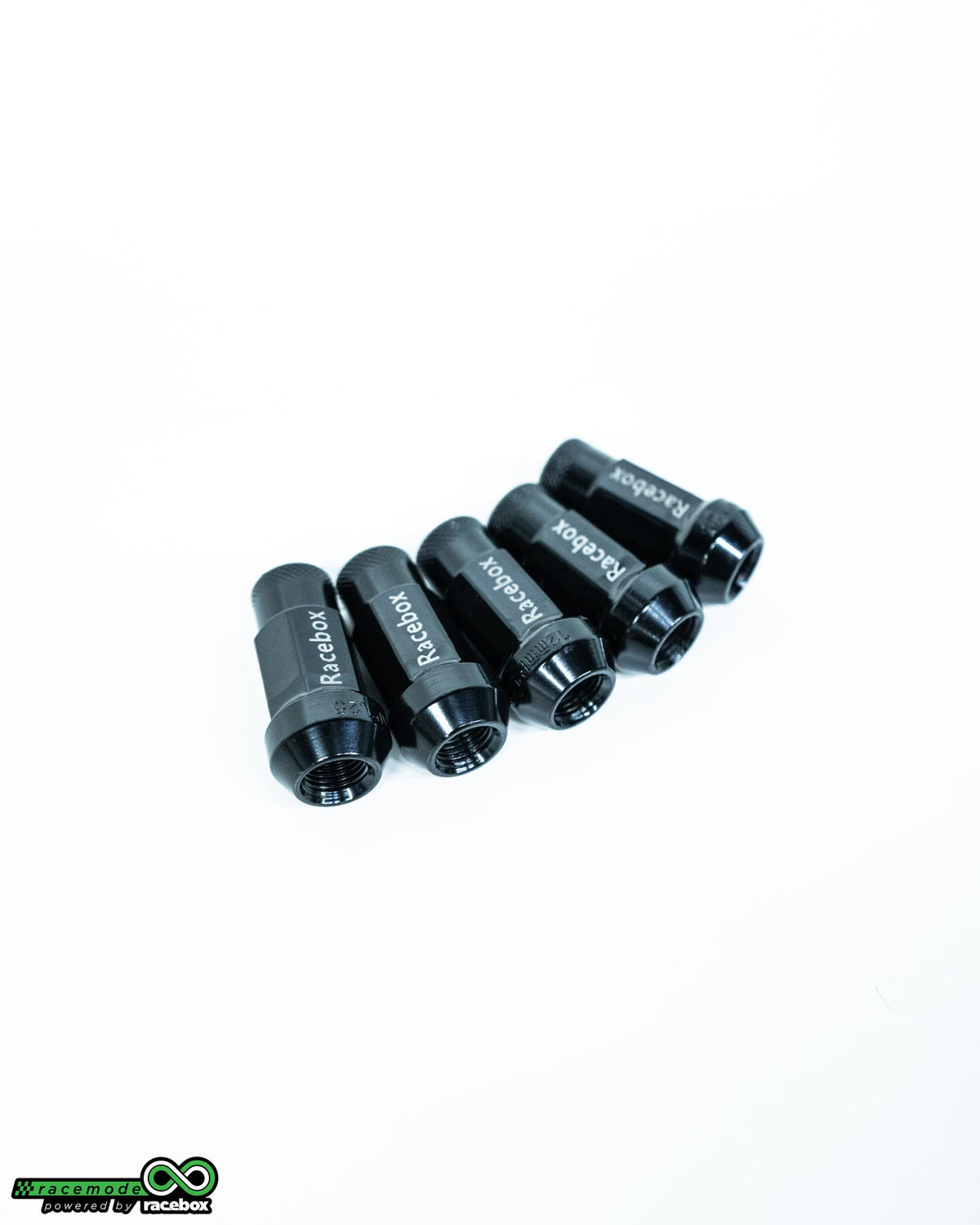 Five Racebox black forged steel M12x1.25 racing lug nuts arranged in a row