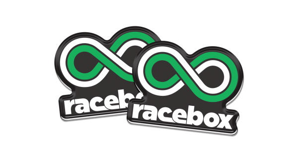 Two Racebox green infinity logo domed decals side by side